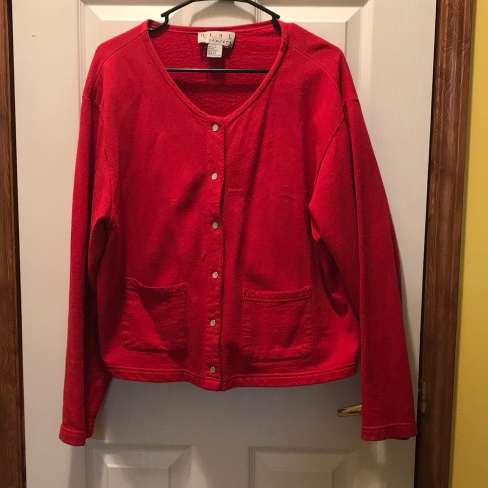Red jacket or can be worn as a top buttoned up.